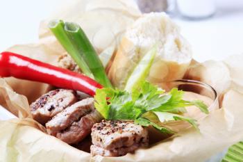 Roast pork tenderloin with roll and sauce - detail