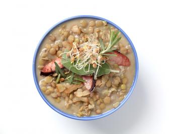 Bowl of lentil soup with sausage 