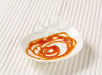 Caramel drizzle sauce on plate