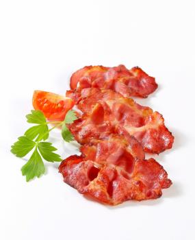 Crispy slices of bacon - studio shot