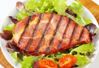 Grilled pork neck meat with salad greens