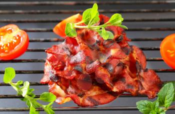 Crispy bacon on barbecue grill