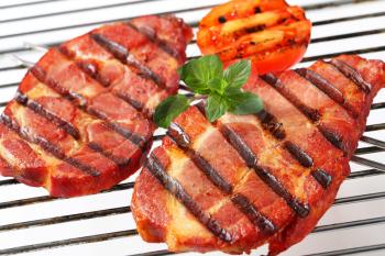 Grilled smoked pork neck steaks