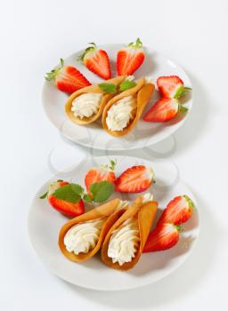 Czech cream-filled gingerbread cookies (Stramberk ears) with fresh strawberries