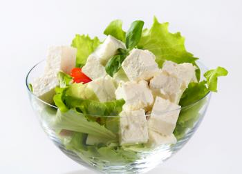 Green salad with feta cheese, tomatoes and pepper