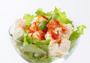 Diced feta cheese with fresh vegetable salad