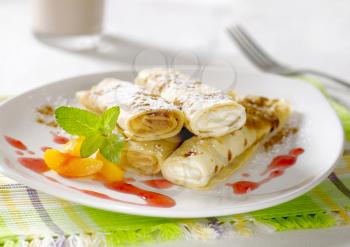 Rolled up crepes filled with sweet fillings 