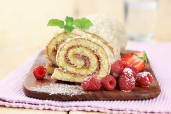 Swiss roll glazed with white chocolate icing