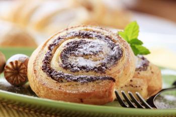 Breakfast pastry - Poppy seed snails dusted with icing sugar