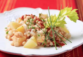 White bean and potato salad sprinkled with chives