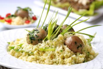 Vegetarian meal - Couscous with button mushrooms, pesto and spring onion