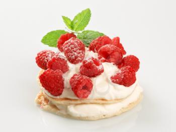Pancakes with sweet creamy cheese and fresh raspberries