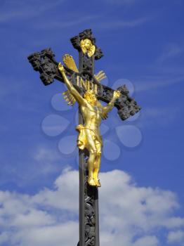 Gilded sculpture of Jesus Christ on iron cast crucifix  