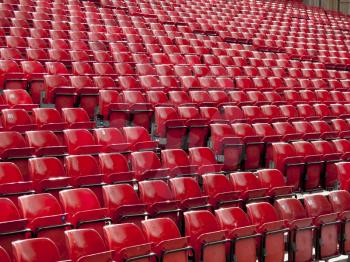 Rows of red seats at a stadium 