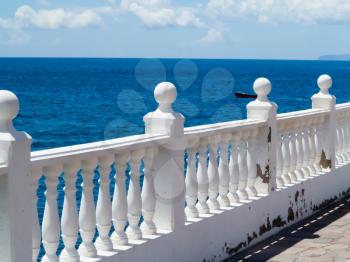 View to the sea from a terrace with balustrade