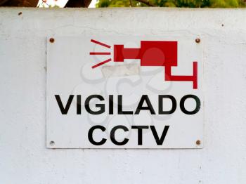 Sign warning that premises are watched by security cameras