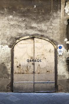 Weathered wall and rusty garage door
