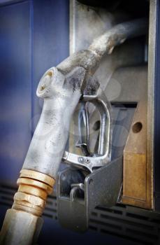 Closeup of a rusty gas pump nozzle
