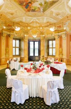 Interior of a luxury restaurant, tables set for a special occasion