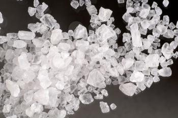 Macro of sea salt crystals on black background
