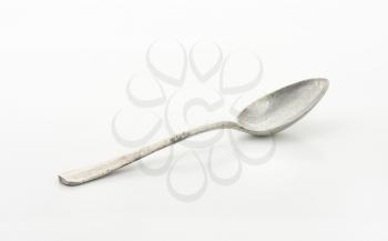 Used metal spoon with deep cup