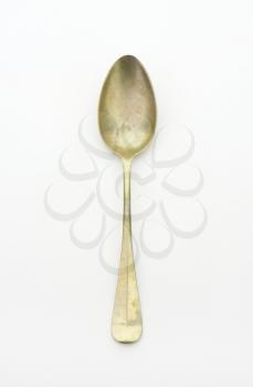 Old silver spoon covered with tarnish