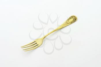 Antique dinner fork with ornate handle