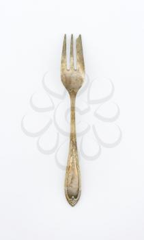 Vintage pastry fork with ornate handle