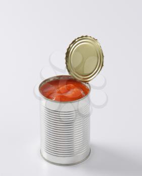 can of peeled tomatoes on white background