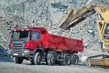 Dump Truck and Excavator in a Quarry
