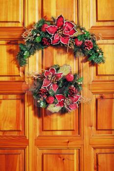 Christmas wreath on front wooden door