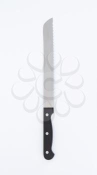long kitchen knife with serrated blade
