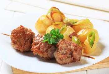 Meatballs on a stick with potatoes