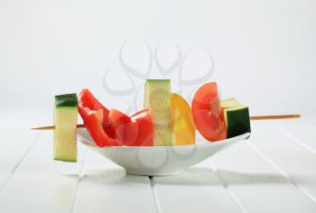 Pieces of fresh vegetables on wooden skewer