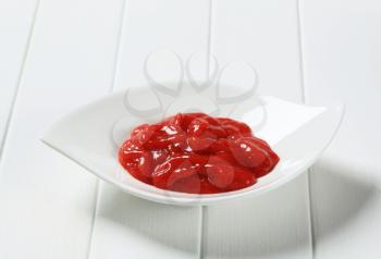 Tomato dipping sauce in white bowl