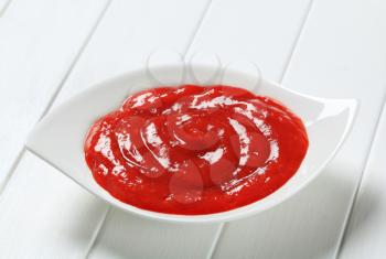 Tomato dipping sauce in white bowl