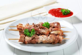 Pork skewers and tomato dipping sauce