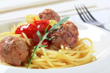 Pan fried meatballs with spaghetti and ketchup