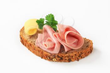 Slice of whole wheat bread with ham