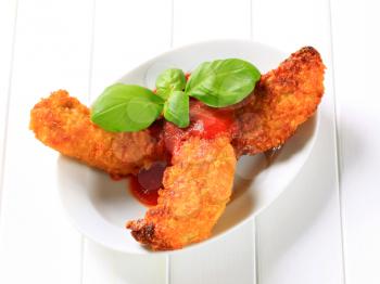Crispy fritters with tomato dipping sauce 