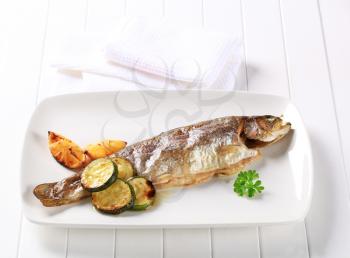 Oven baked trout with lemon and courgette
