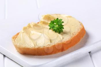 Slice of white bread with butter