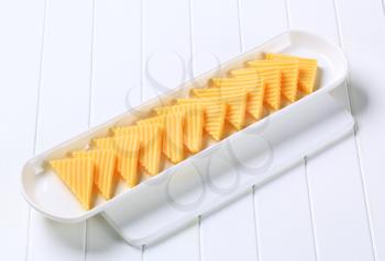 Hard cheese cut into triangles 