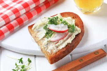 Pan fried bread with cheese spread and cress