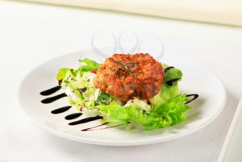 Vegetable burger with green salad