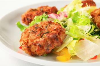 Fried vegetable burgers with green salad