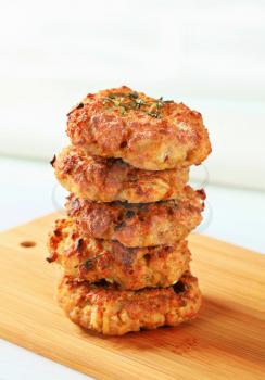 Fried vegetable burgers on cutting board