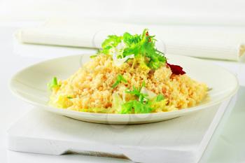 Couscous garnished with salad greens