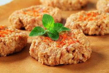 Raw vegetable burgers on baking parchment paper