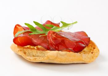 Friselle bread with thin slices of smoked beef
